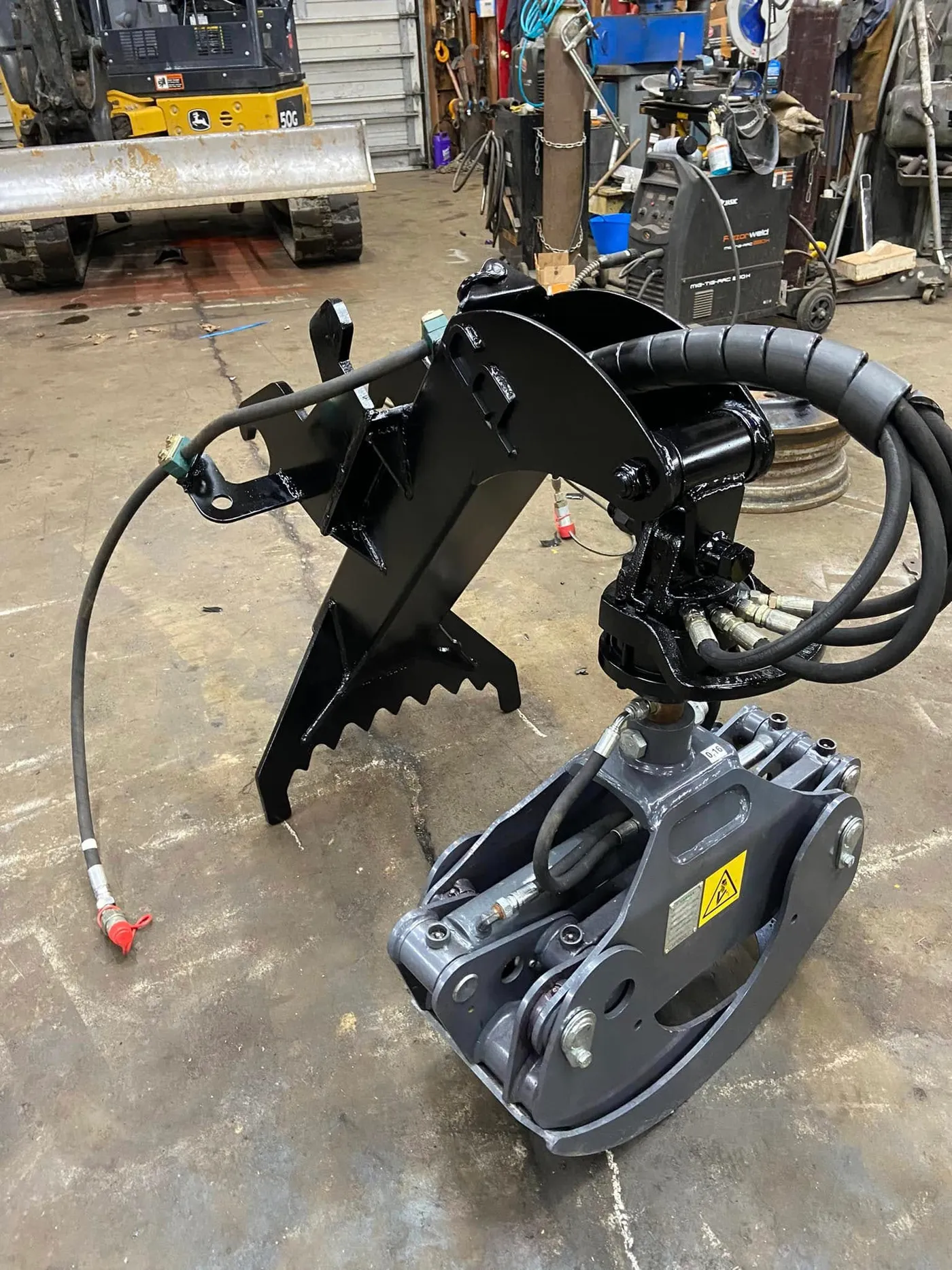 One-off custom grapple attachment built in the shop