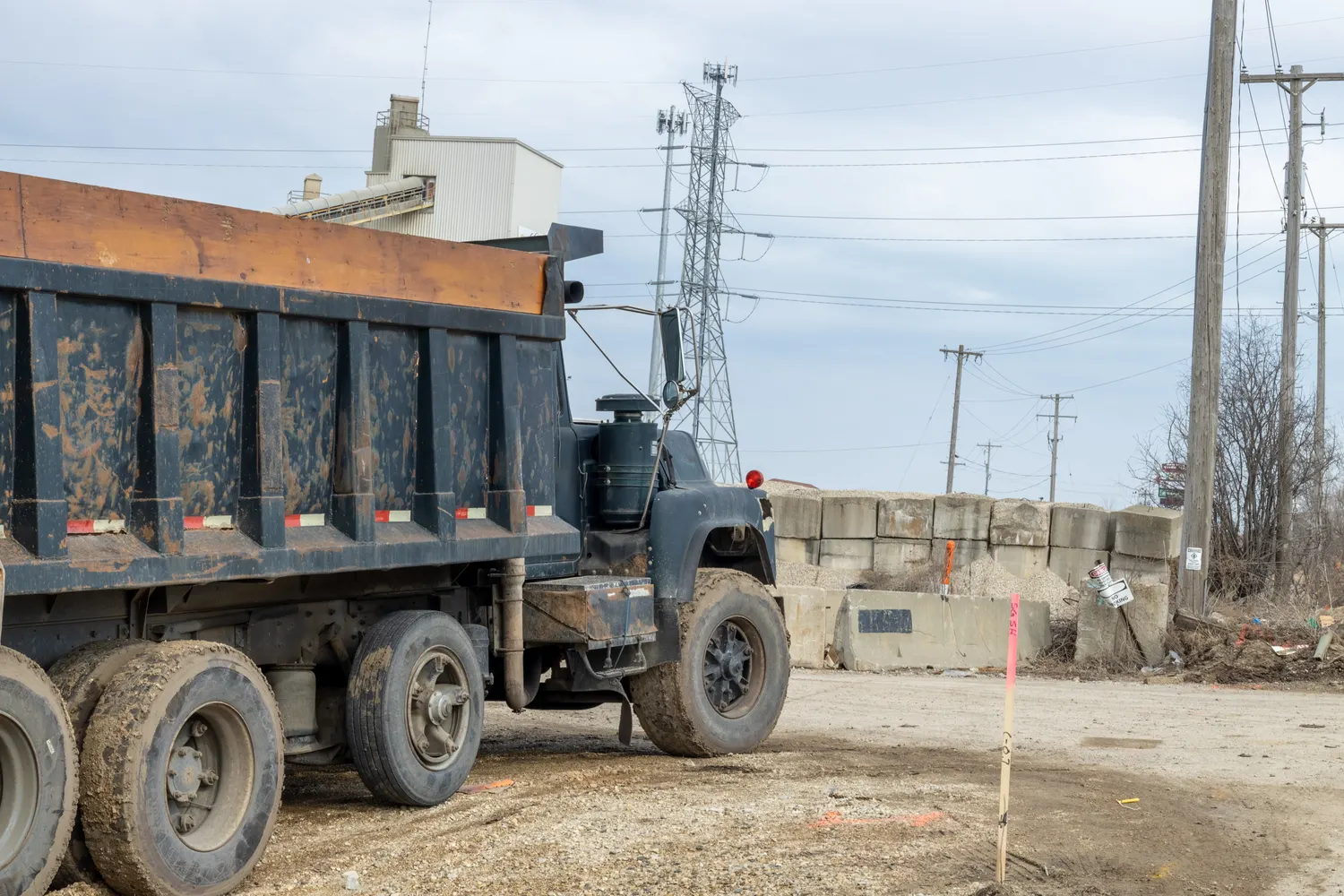 Heavy dump truck parked at a work yard