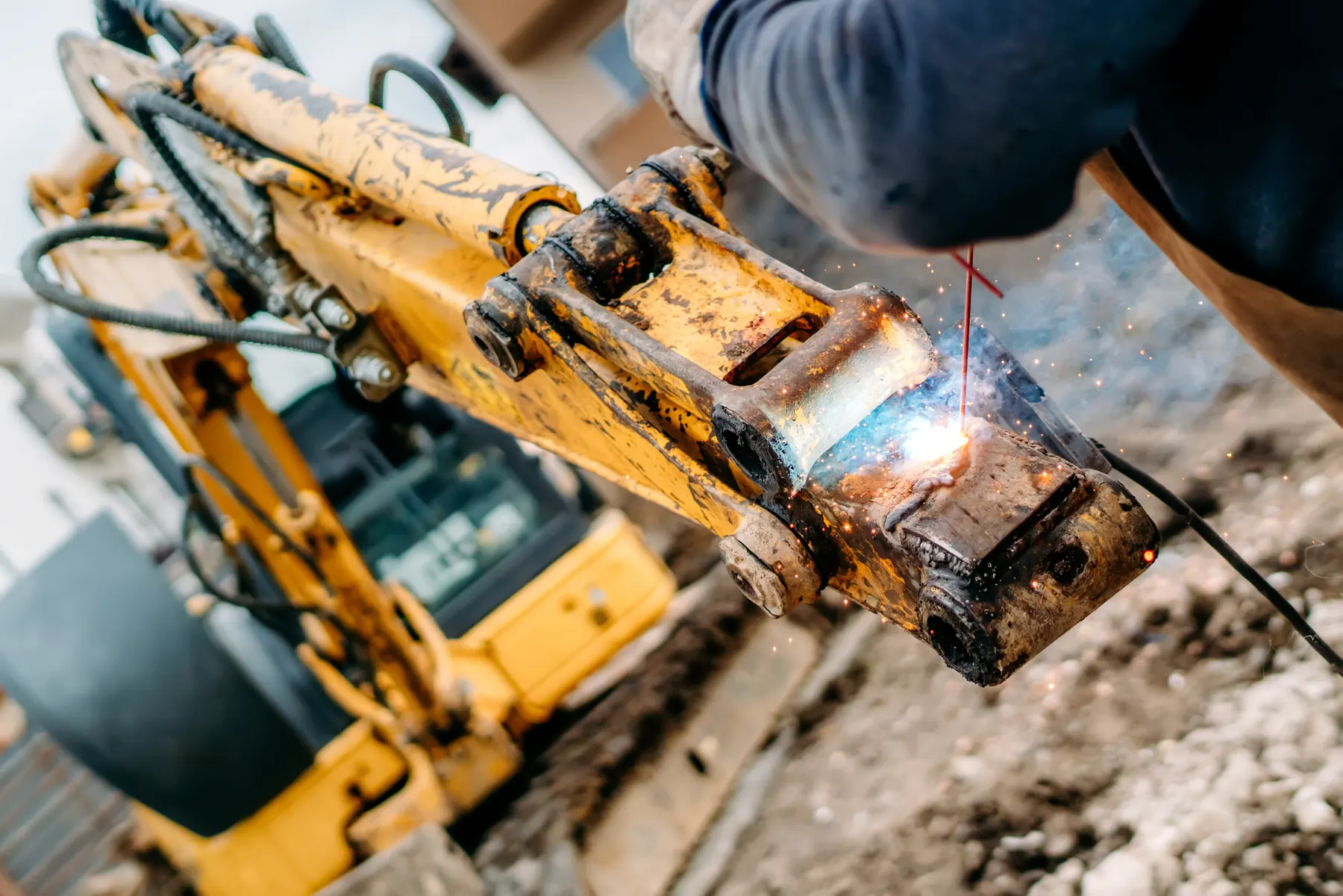 Welding repair on heavy equipment in the shop