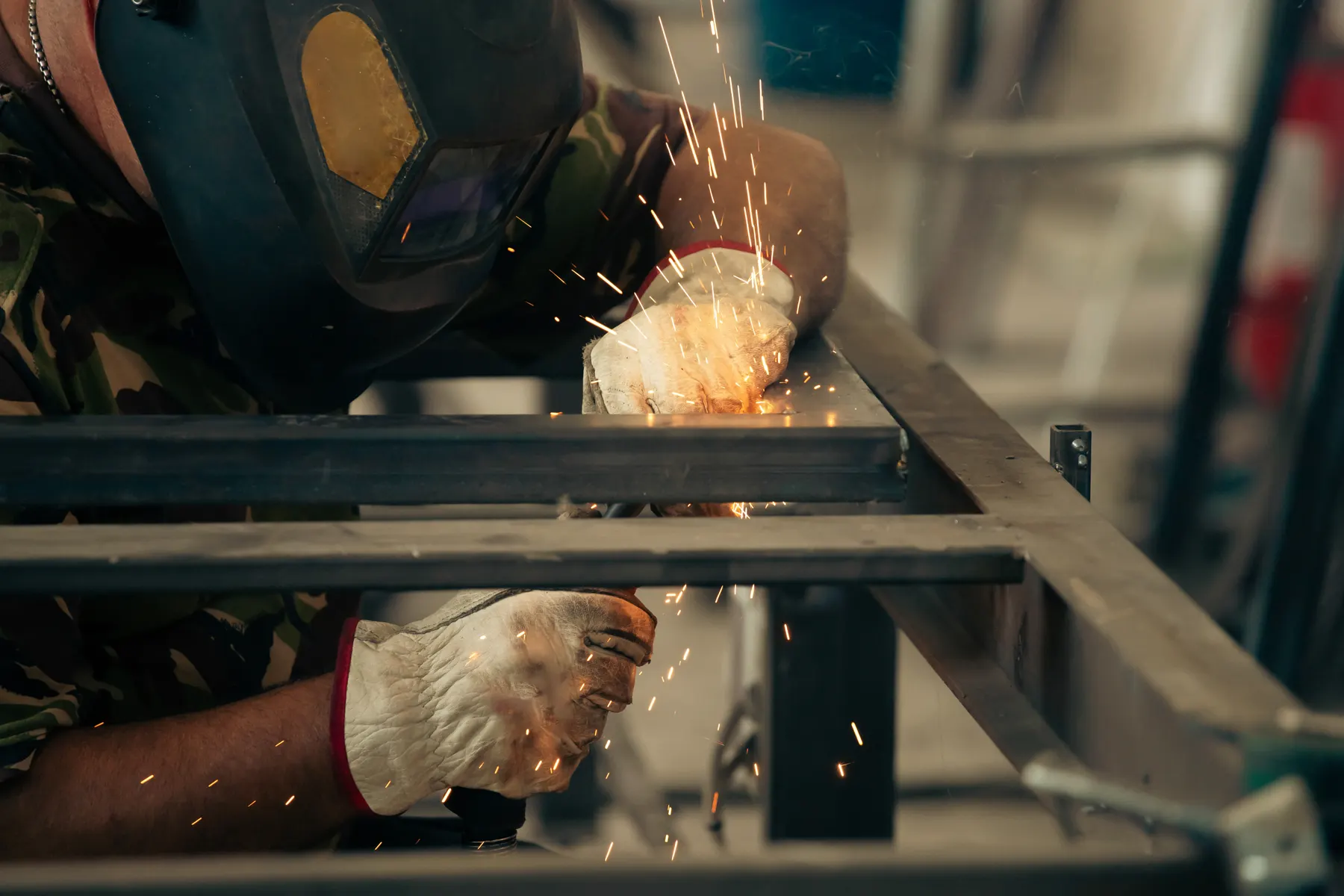 Welder building a custom steel frame